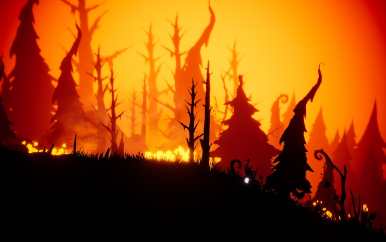 En fantasivärld i ett spel, skog i silhuett mot flammande himmel i orange och rött.